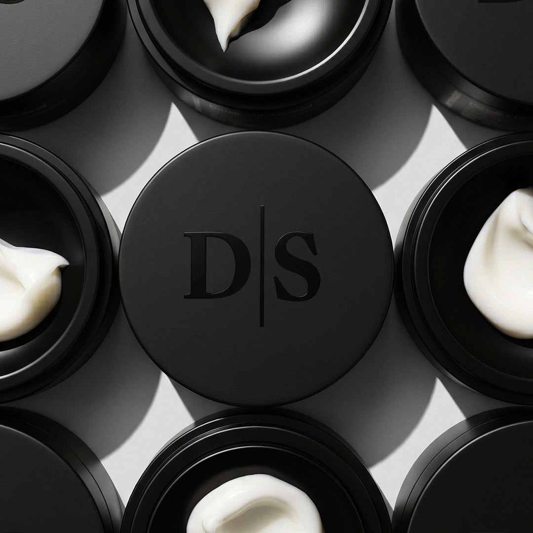 Deviant Skincare, Peptide + GF Advanced Restore Cream in a black jar with cream texture