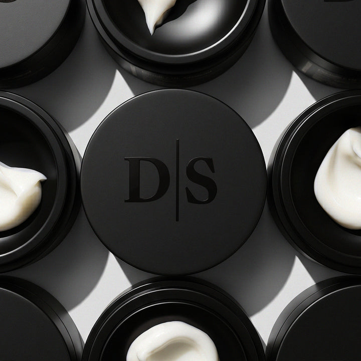 Deviant Skincare, Peptide + GF Advanced Restore Cream in a black jar with cream texture